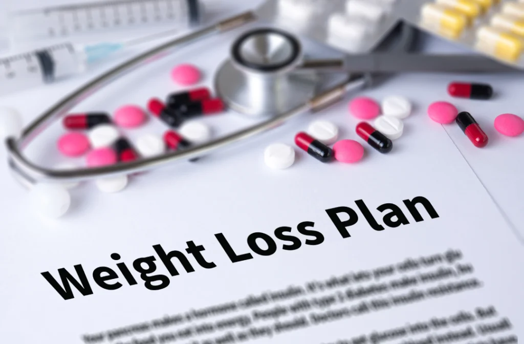 A medical weight loss plan with pills, a stethoscope, and medical documents highlighting treatment options.