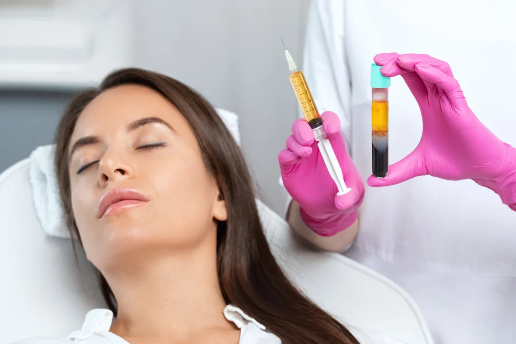 Syringe and test tube held during facial treatment procedure